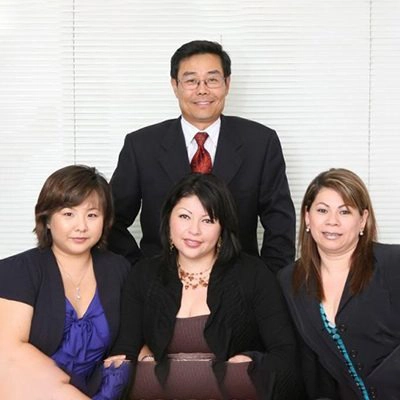 Chiropractor Andrew Choi with three team members